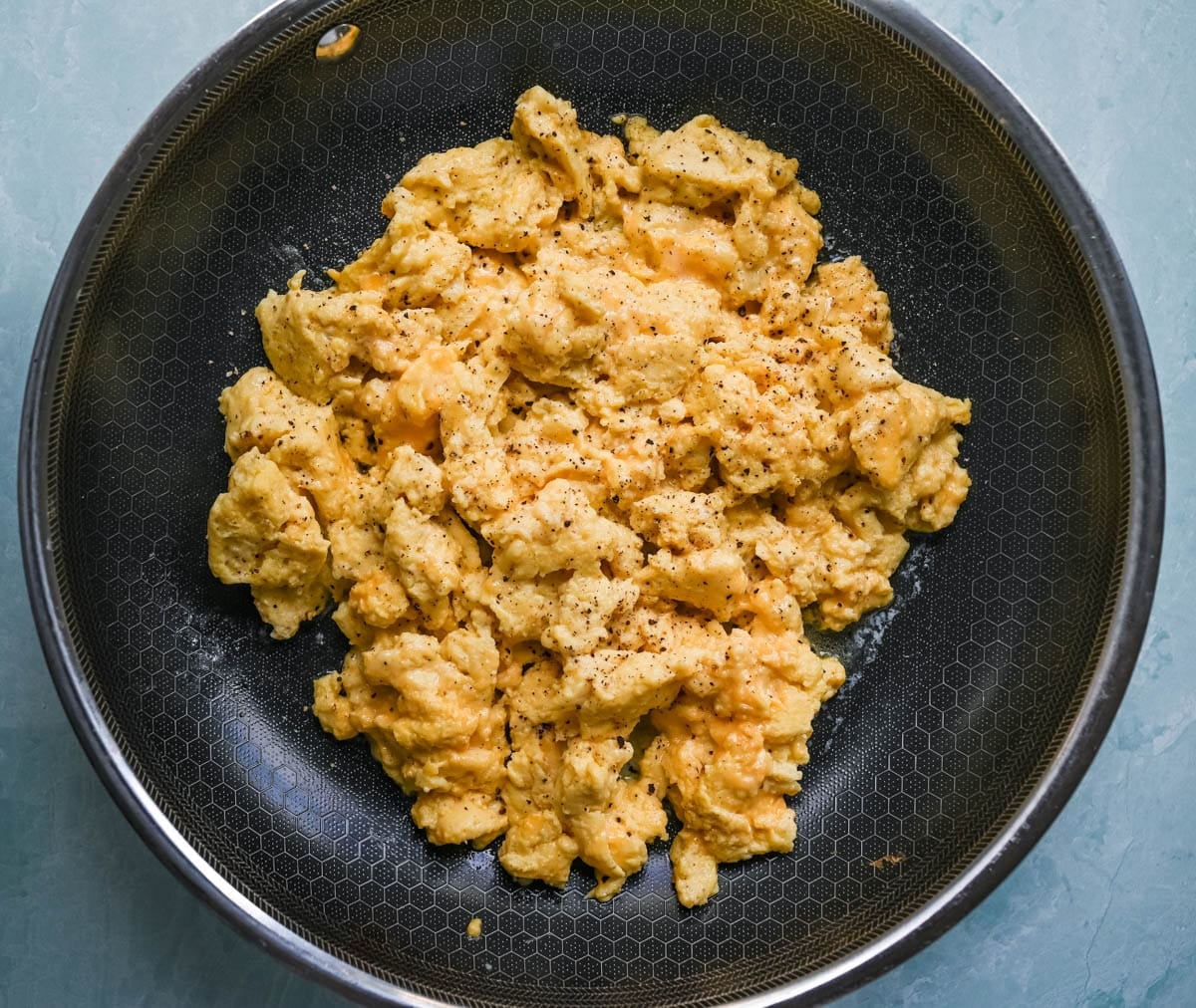 These Cottage Cheese Scrambled Eggs are the creamiest, fluffiest scrambled eggs you'll ever make — with over 20g of protein per serving! Learn the simple technique, the best mix-ins, and every tip for perfect scrambled eggs every time.