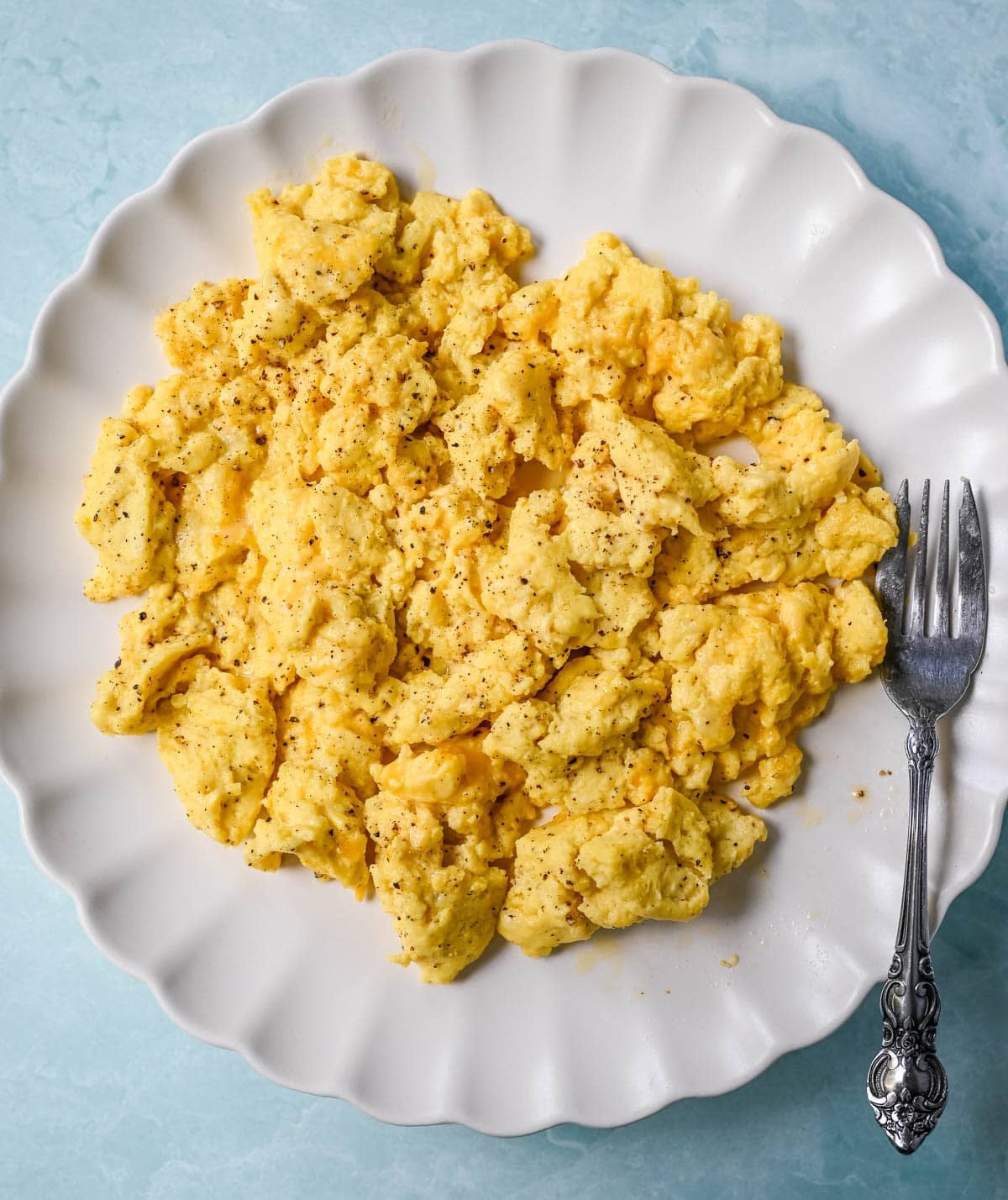 These Cottage Cheese Scrambled Eggs are the creamiest, fluffiest scrambled eggs you'll ever make — with over 20g of protein per serving! Learn the simple technique, the best mix-ins, and every tip for perfect scrambled eggs every time.