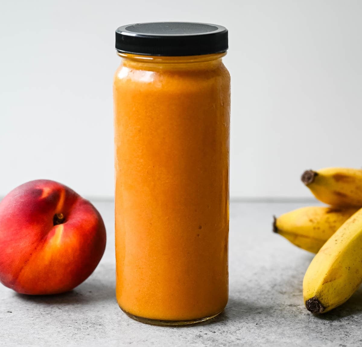 Golden, warmly spiced, and packed with stone fruit sweetness — turmeric and ginger add a subtle kick to this tropical smoothie.