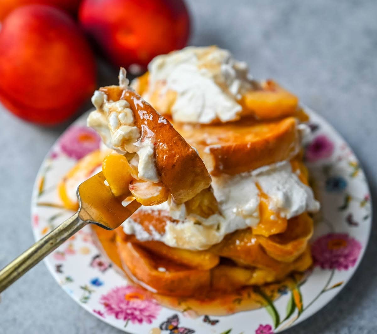 This Peaches and Cream French toast is made with thick slices of challah or brioche bread soaked in a rich, creamy custard, then topped with fresh whipped cream, juicy peaches, and real maple syrup. It's the ultimate easy peach French toast recipe.