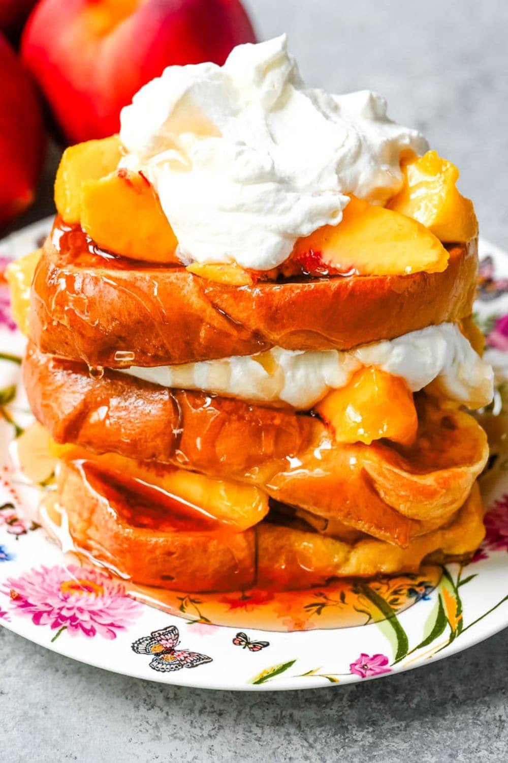 This Peaches and Cream French toast is made with thick slices of challah or brioche bread soaked in a rich, creamy custard, then topped with fresh whipped cream, juicy peaches, and real maple syrup. It's the ultimate easy peach French toast recipe.