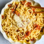 This Carbonara Udon recipe is creamy, cheesy, and ridiculously easy. This viral Japan noodle dish is a quick and easy 20-minute weeknight dinner. Thick udon noodles, silky egg yolk and parmesan cheese sauce, crispy bacon, and tons of black pepper. It's the viral Tokyo dish everyone's been lining up for, except you can make it at home in no time at all.