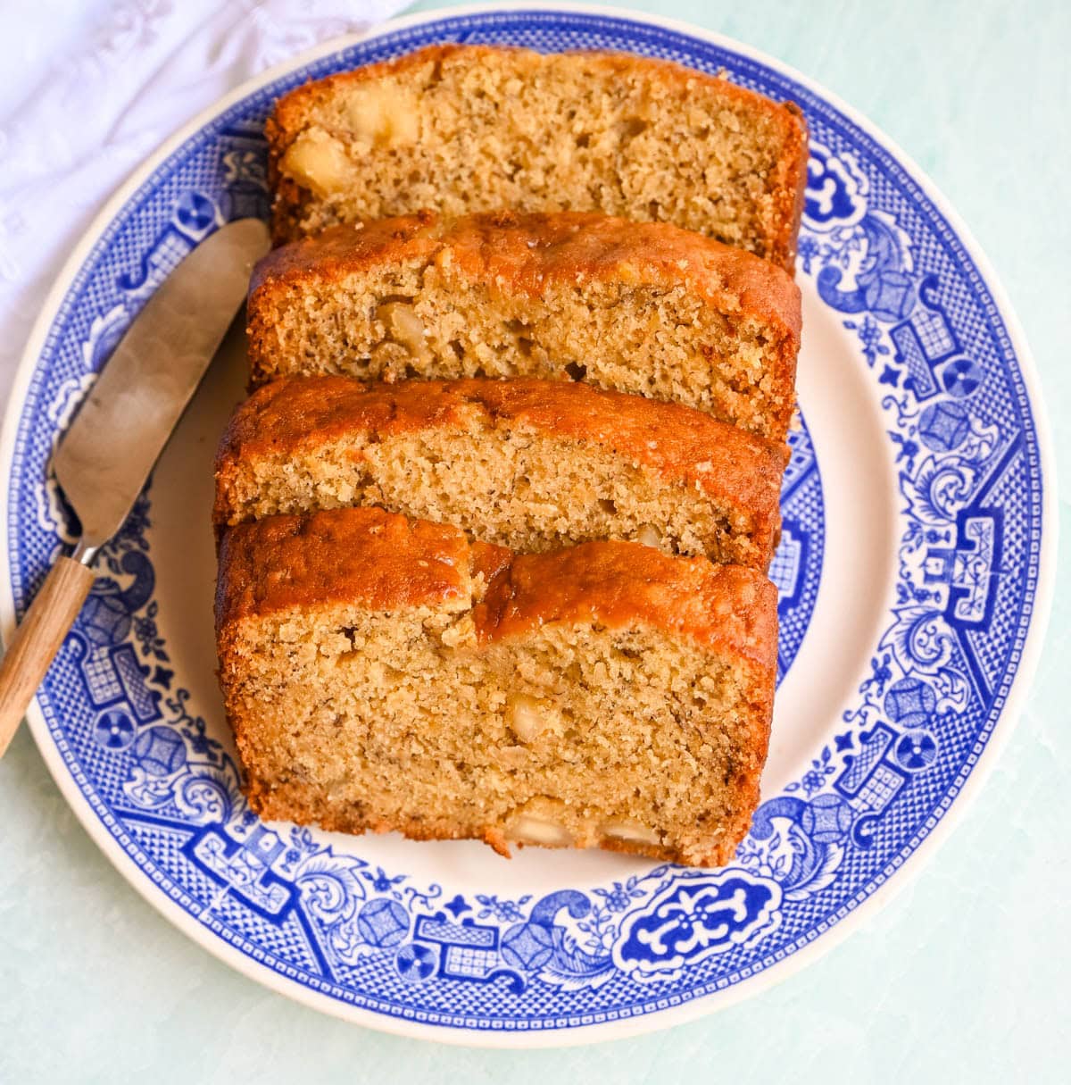 Best Banana Nut Bread Recipe. This is the moistest banana nut bread you'll ever make — a rich, tender loaf made with ripe bananas, sour cream, and your choice of walnuts, pecans, or macadamia nuts. Includes tips for the ultimate moist crumb, a brown sugar topping, and answers to every banana bread question you have.