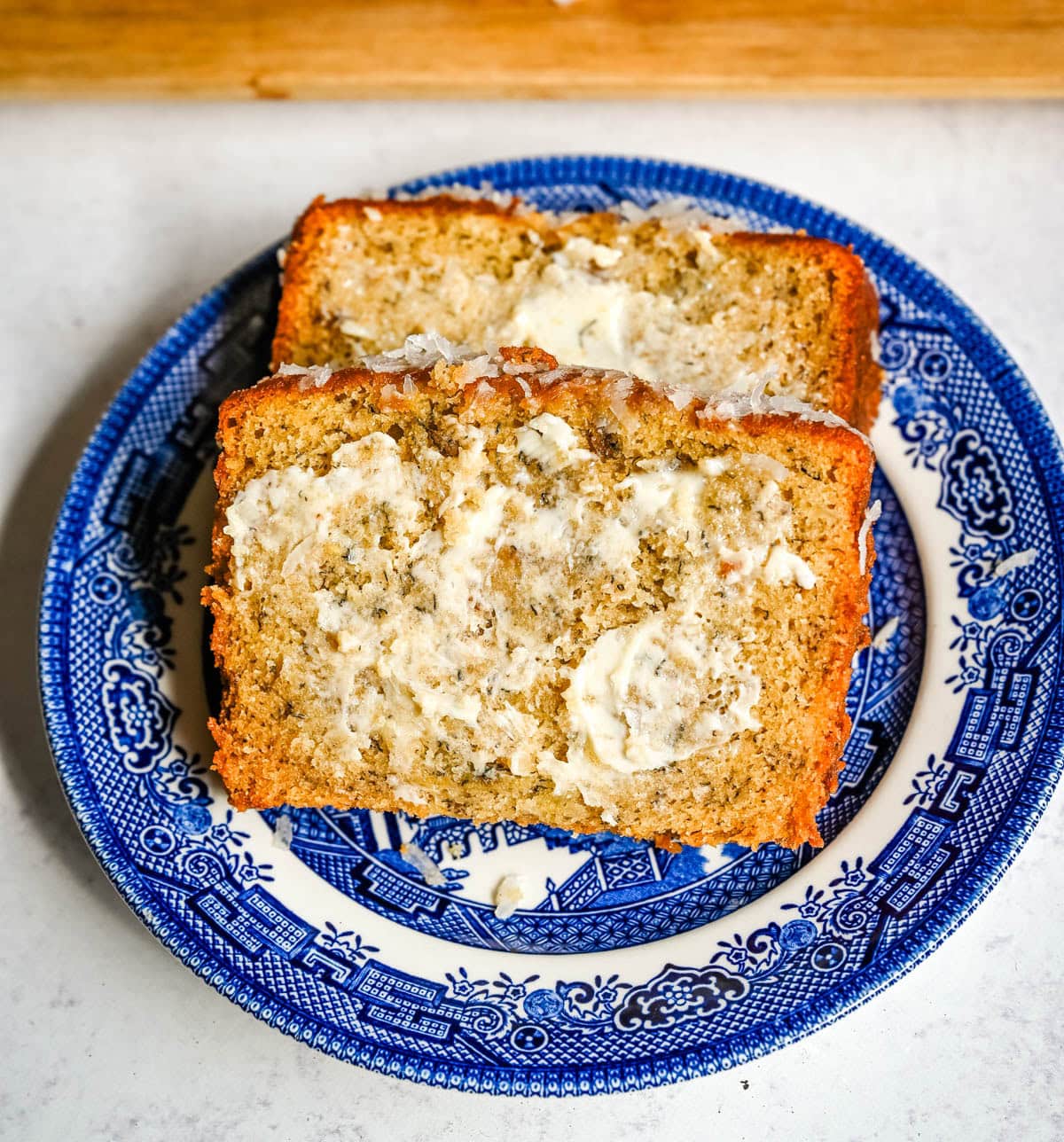 Best Banana Nut Bread Recipe. This is the moistest banana nut bread you'll ever make — a rich, tender loaf made with ripe bananas, sour cream, and your choice of walnuts, pecans, or macadamia nuts. Includes tips for the ultimate moist crumb, a brown sugar topping, and answers to every banana bread question you have.