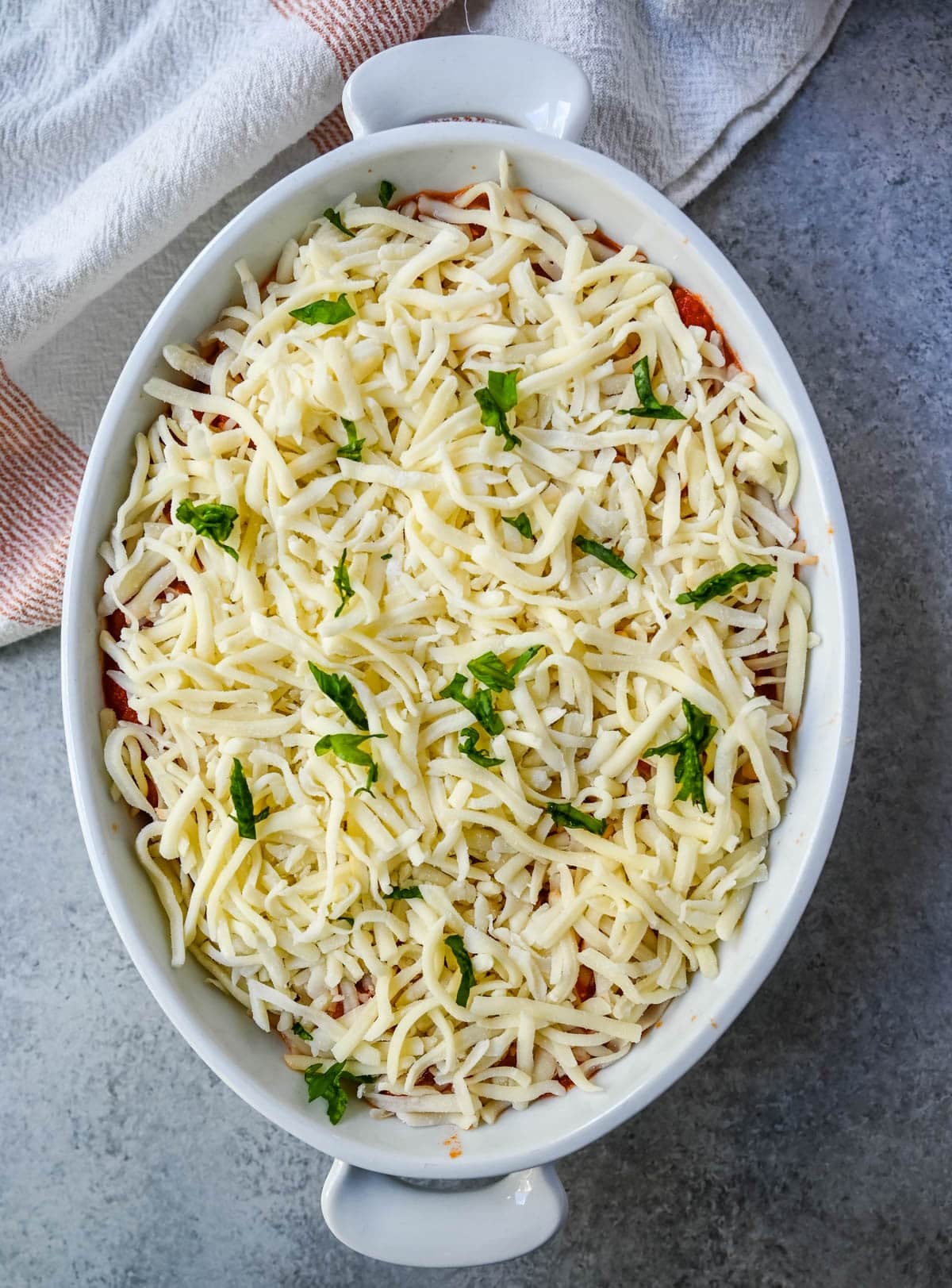 cheesy baked gnocchi with marinara and mozzarella before baking