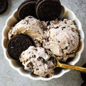 This Cookies and Cream Ice Cream is rich, creamy, and loaded with Oreo chunks. This Oreo Ice Cream is made with a custard base for the smoothest, creamiest homemade ice cream you'll ever make.