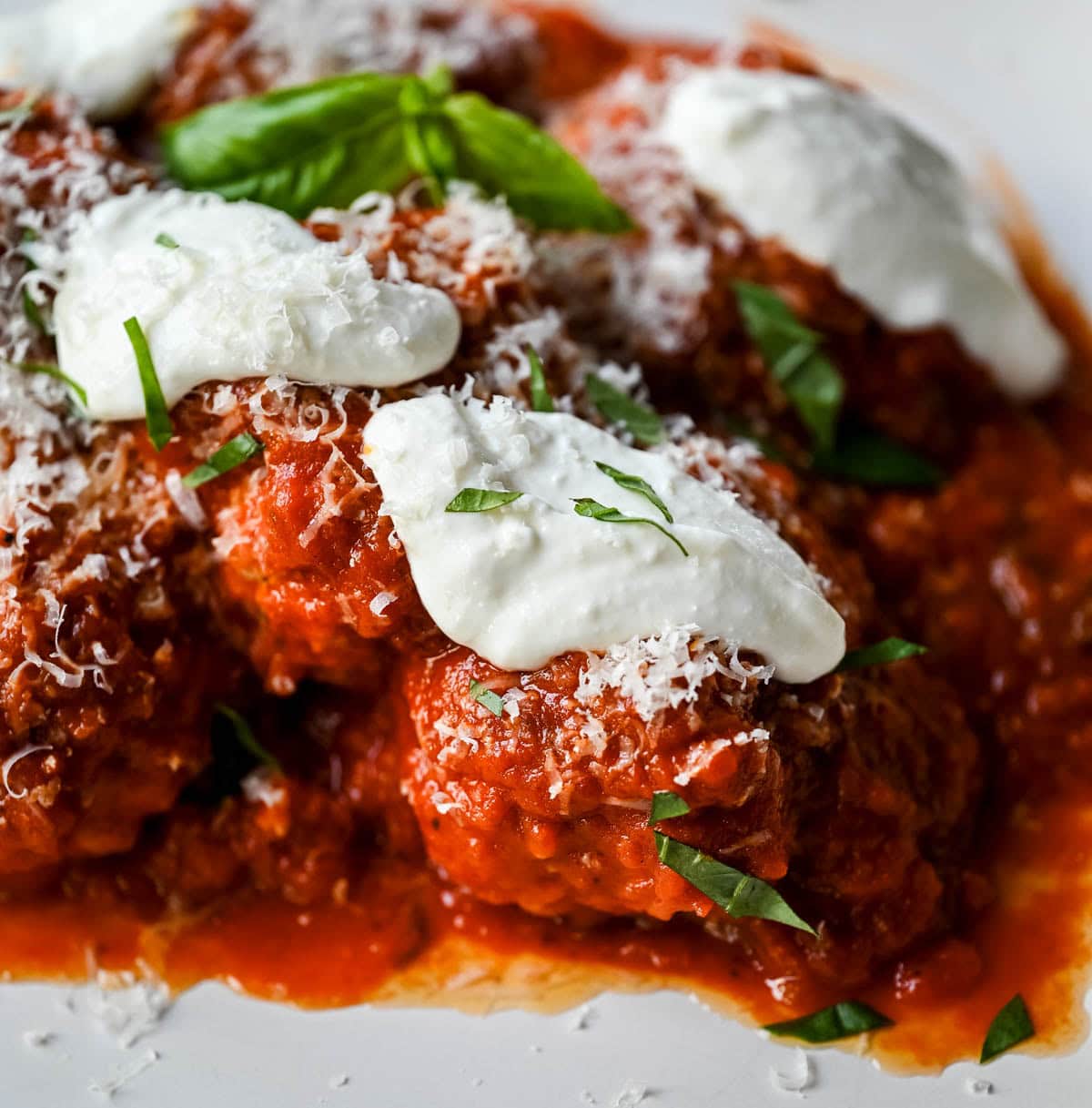 Learn how to make high protein chicken cottage cheese meatballs at home. This easy chicken parmesan meatballs recipe uses whipped cottage cheese, garlic, and parmesan for a juicy, protein-packed dinner that's ready in under 30 minutes. Here's the viral TikTok recipe made famous by Hailey Bieber.