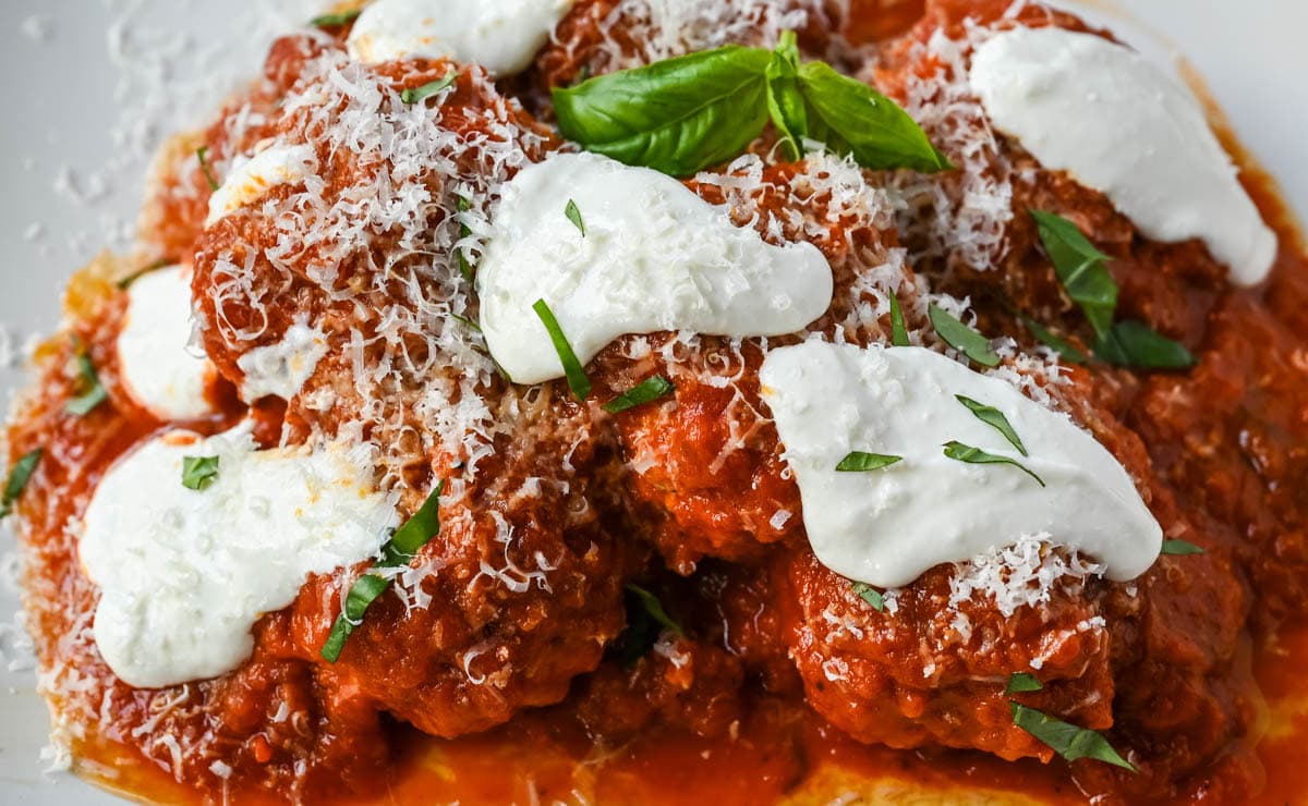 Learn how to make high protein chicken cottage cheese meatballs at home. This easy chicken parmesan meatballs recipe uses whipped cottage cheese, garlic, and parmesan for a juicy, protein-packed dinner that's ready in under 30 minutes. Here's the viral TikTok recipe made famous by Hailey Bieber.