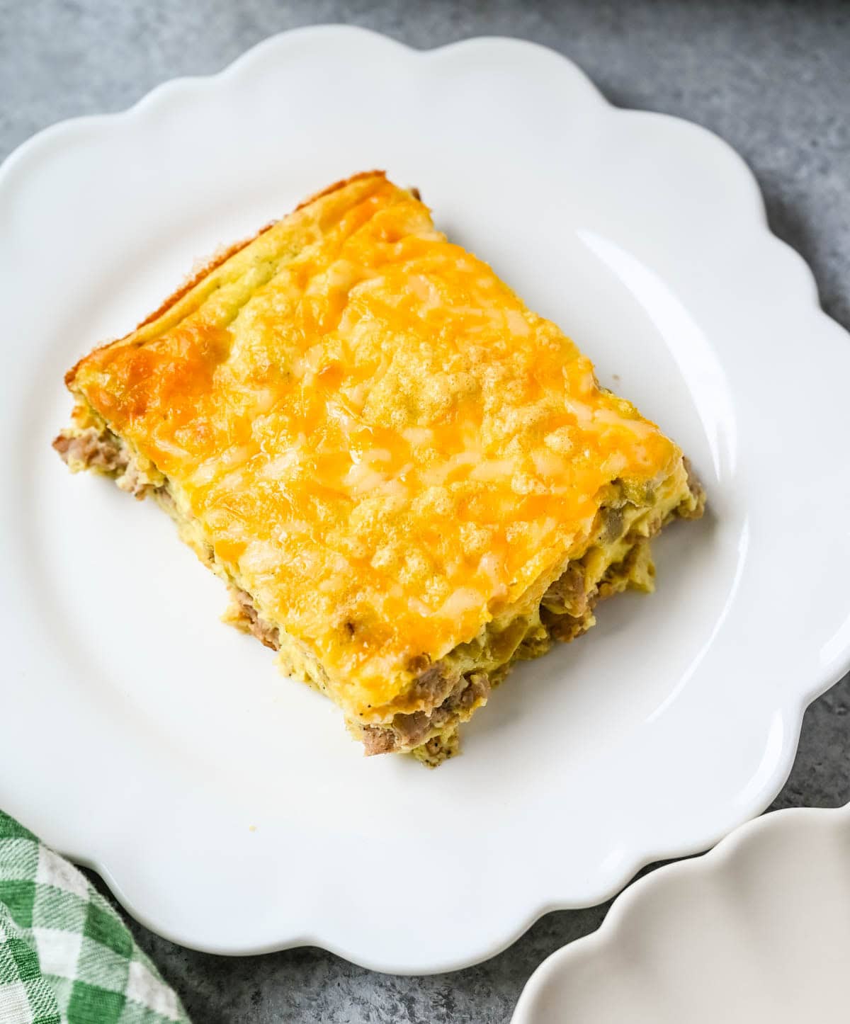High Protein Turkey Sausage and Green Chile Egg Casserole. This high protein breakfast casserole combines turkey sausage, cottage cheese, cheddar, eggs, and green chiles for a hearty, low-carb make-ahead breakfast. With about 30 grams of protein per serving, this easy egg bake is perfect for meal prep, brunch, or feeding a crowd.