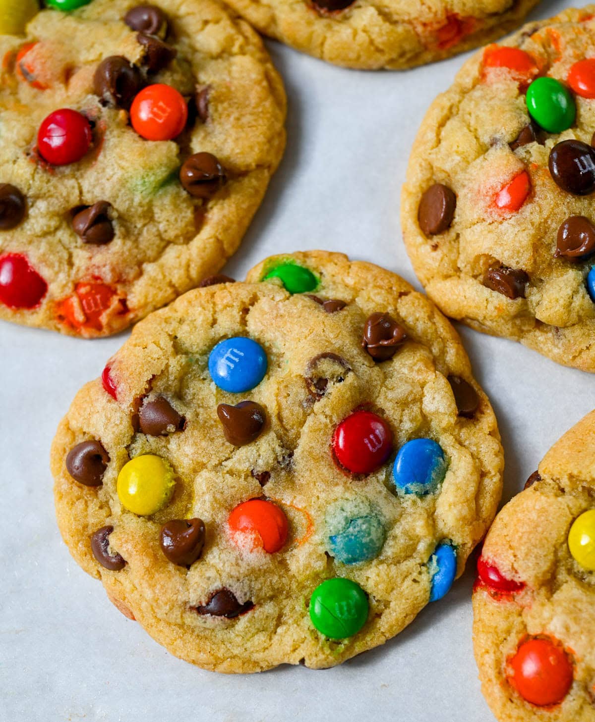 These M&M chocolate chip cookies have crisp, buttery edges and soft, chewy centers, loaded with both M&M's and semi-sweet chocolate chips. No mixer required — just mix in a bowl, chill, and bake for the best chocolate chip M&M cookies!