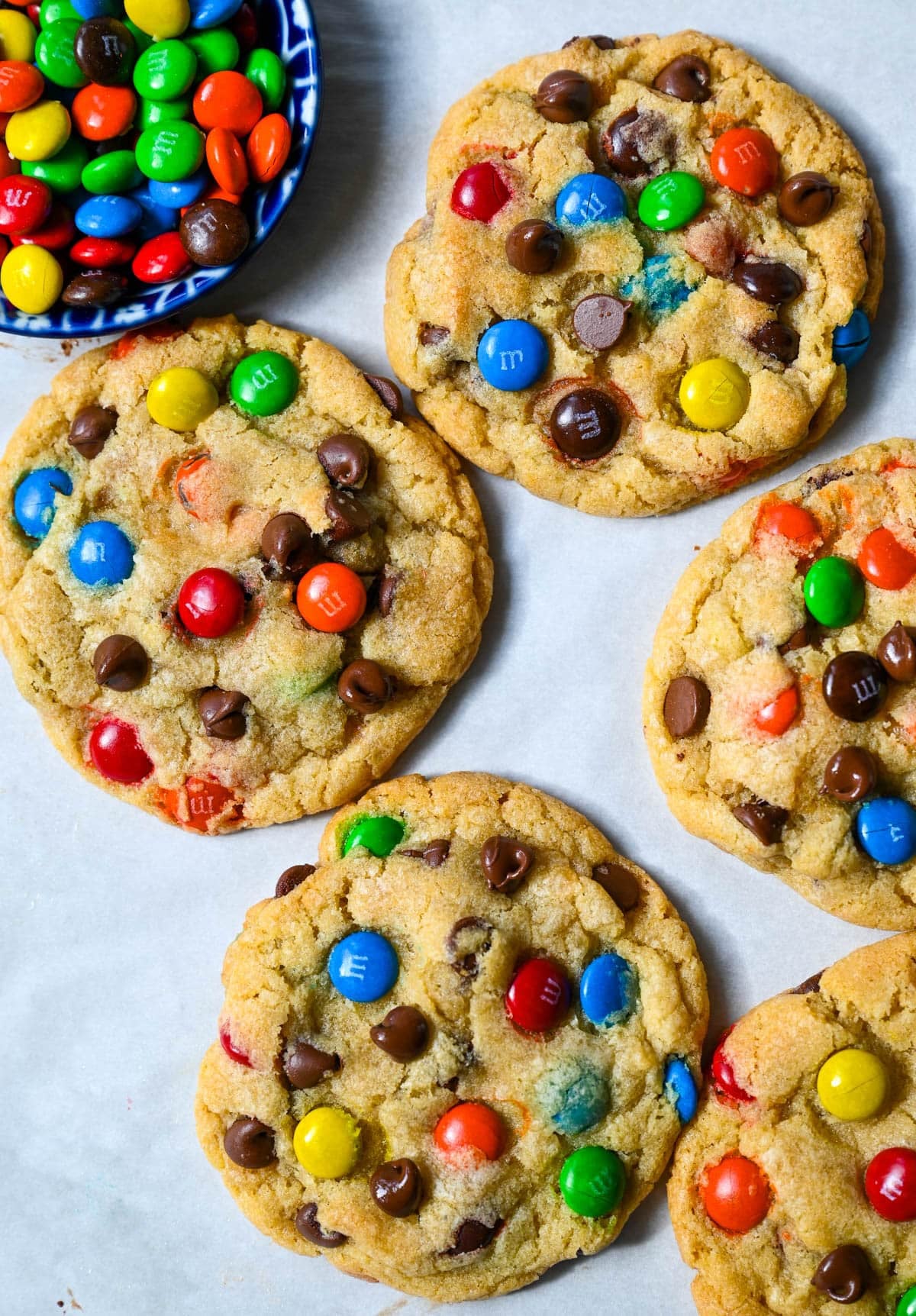 These M&M chocolate chip cookies have crisp, buttery edges and soft, chewy centers, loaded with both M&M's and semi-sweet chocolate chips. No mixer required — just mix in a bowl, chill, and bake for the best chocolate chip M&M cookies!
