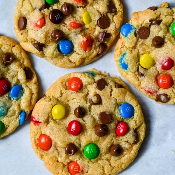 These M&M chocolate chip cookies have crisp, buttery edges and soft, chewy centers, loaded with both M&M's and semi-sweet chocolate chips. No mixer required โ just mix in a bowl, chill, and bake for the best chocolate chip M&M cookies!