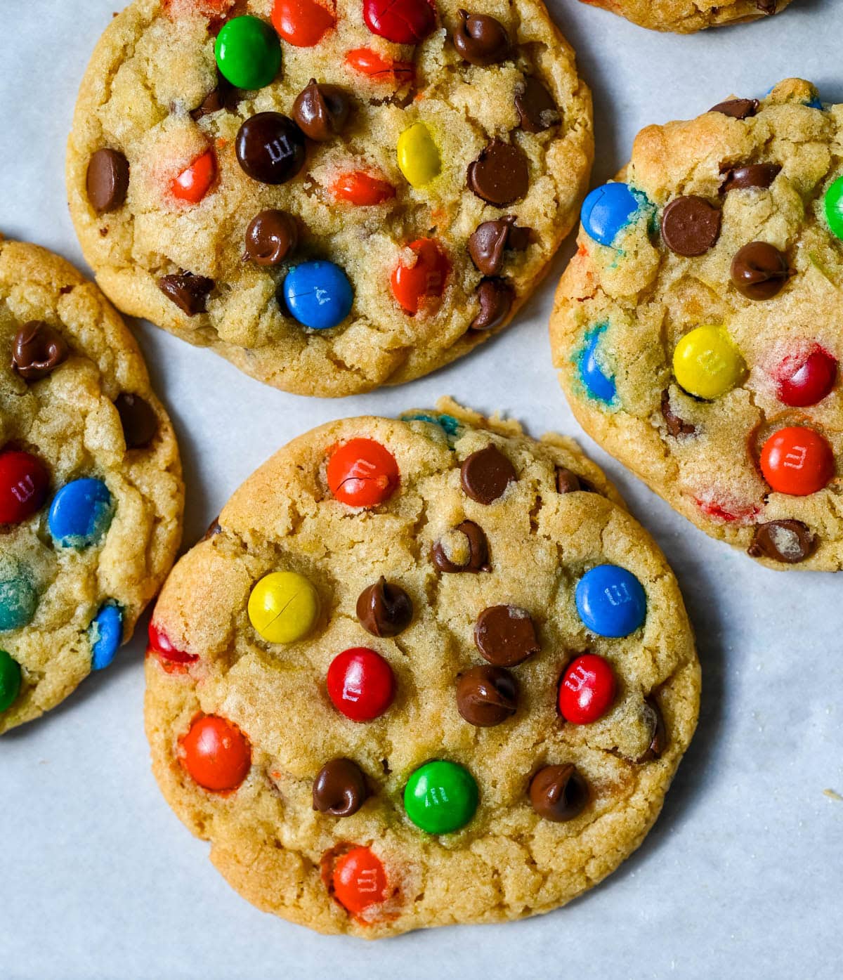 These M&M chocolate chip cookies have crisp, buttery edges and soft, chewy centers, loaded with both M&M's and semi-sweet chocolate chips. No mixer required — just mix in a bowl, chill, and bake for the best chocolate chip M&M cookies!