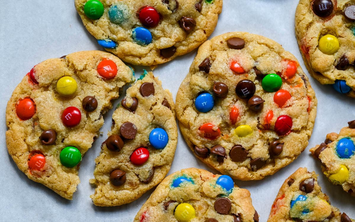 These M&M chocolate chip cookies have crisp, buttery edges and soft, chewy centers, loaded with both M&M's and semi-sweet chocolate chips. No mixer required — just mix in a bowl, chill, and bake for the best chocolate chip M&M cookies!