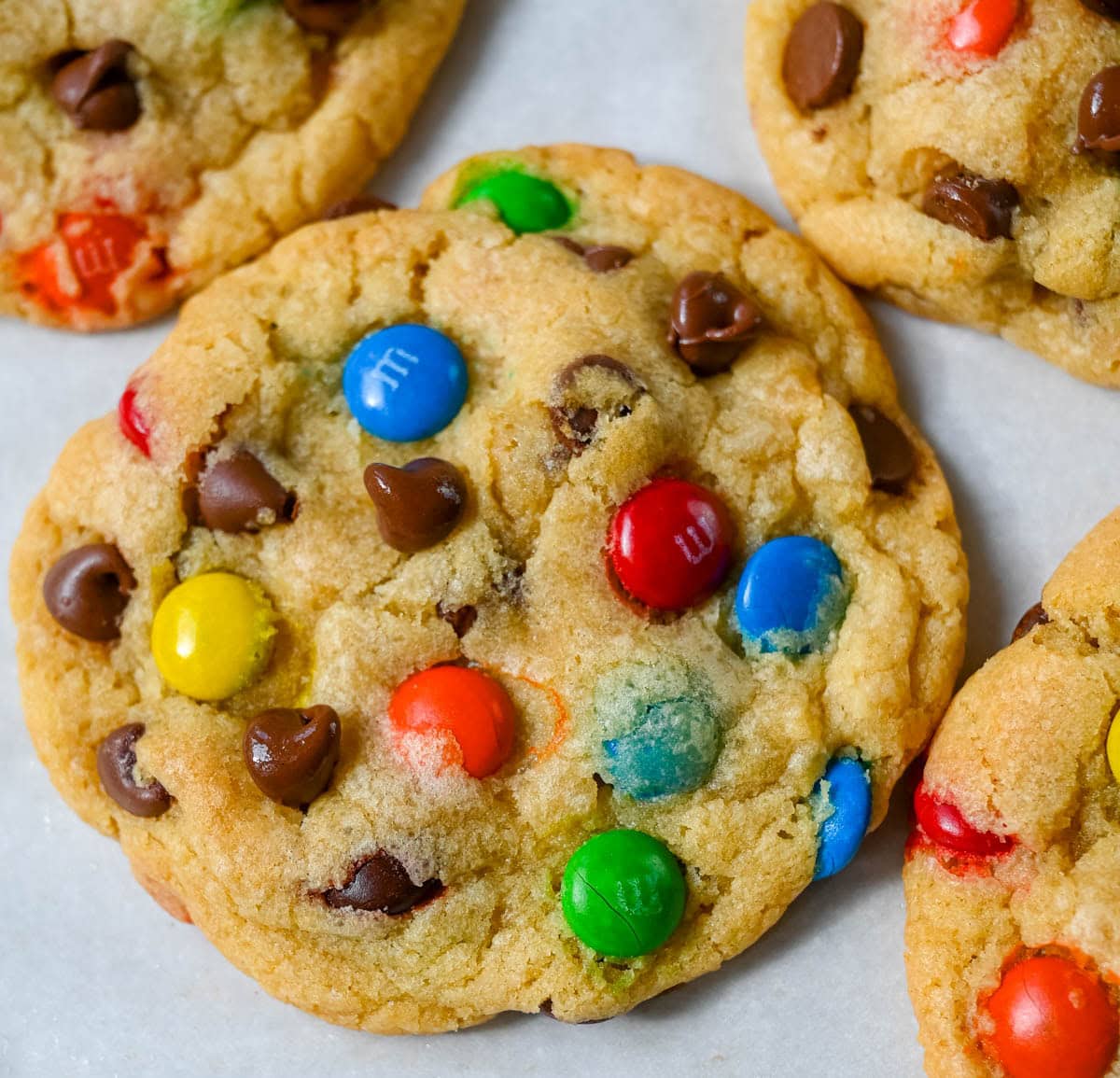 These M&M chocolate chip cookies have crisp, buttery edges and soft, chewy centers, loaded with both M&M's and semi-sweet chocolate chips. No mixer required — just mix in a bowl, chill, and bake for the best chocolate chip M&M cookies!