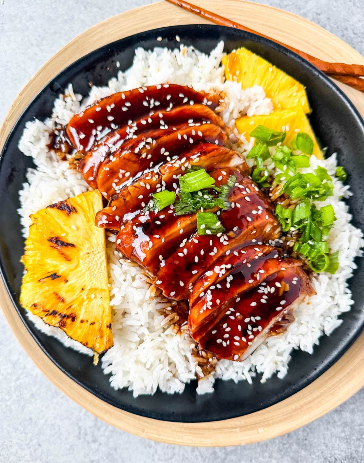This Hawaiian teriyaki chicken is made with a homemade sweet and savory sauce featuring soy sauce, pineapple juice, brown sugar, honey, garlic, and ginger for that classic island-inspired flavor. It's made two easy ways, grilled for smoky char-grilled flavor or cooked in a skillet for a quick 30 minute weeknight dinner, so you can choose whichever method fits your day.