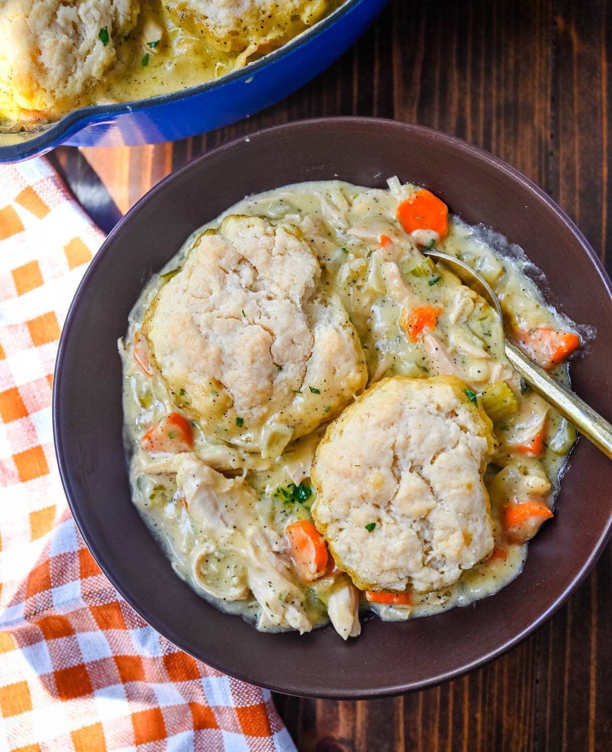This homemade chicken cobbler is the from-scratch version of the viral casserole everyone has been making, with a rich, creamy chicken filling and buttery cheddar garlic drop biscuits baked right on top. No boxed biscuit mix. No canned cream of chicken soup. Just real ingredients and a one-pan dinner that tastes like you spent all afternoon on it.
