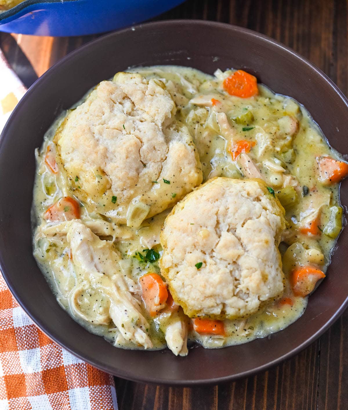 This homemade chicken cobbler is the from-scratch version of the viral casserole everyone has been making, with a rich, creamy chicken filling and buttery cheddar garlic drop biscuits baked right on top. No boxed biscuit mix. No canned cream of chicken soup. Just real ingredients and a one-pan dinner that tastes like you spent all afternoon on it.