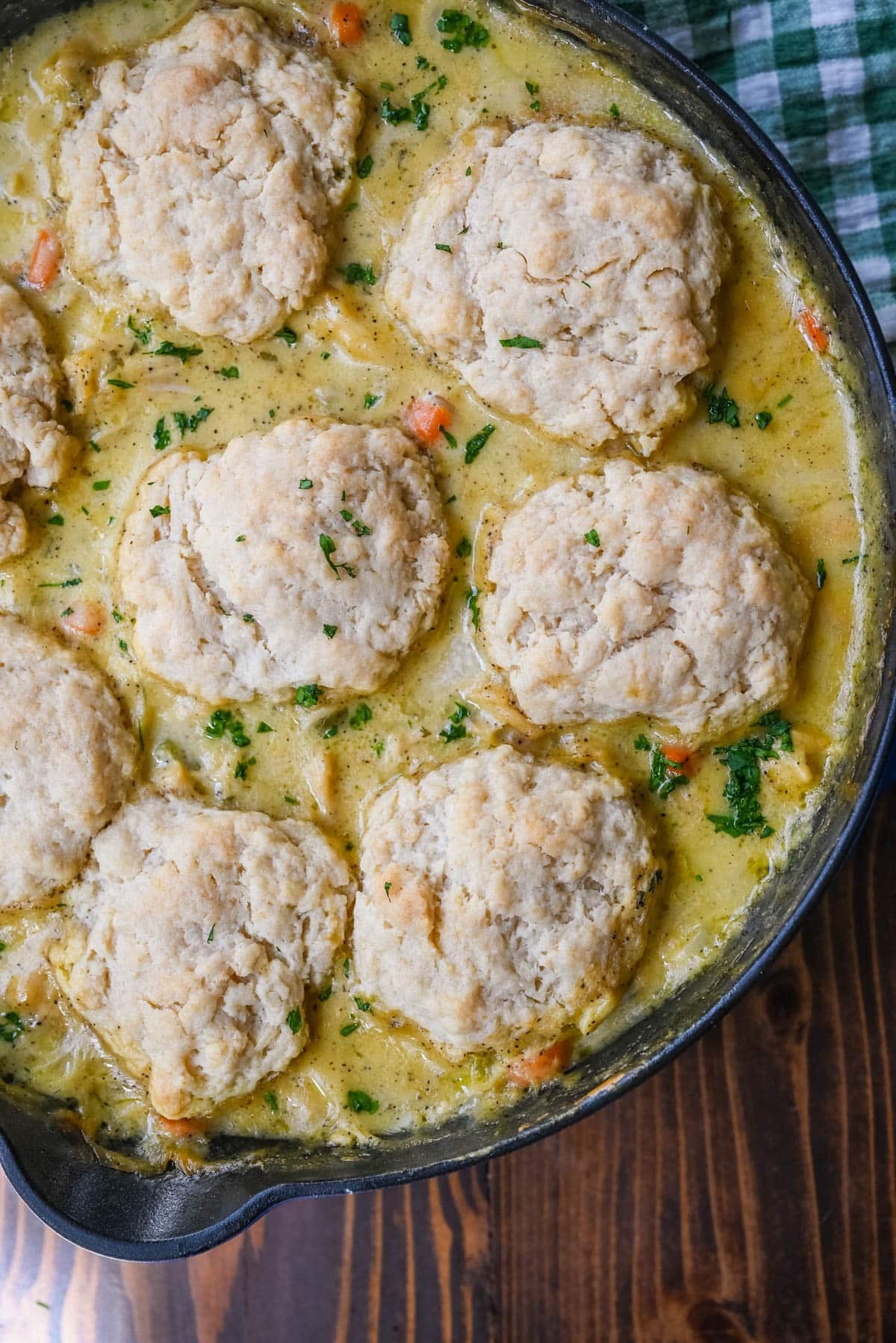This homemade chicken cobbler is the from-scratch version of the viral casserole everyone has been making, with a rich, creamy chicken filling and buttery cheddar garlic drop biscuits baked right on top. No boxed biscuit mix. No canned cream of chicken soup. Just real ingredients and a one-pan dinner that tastes like you spent all afternoon on it.