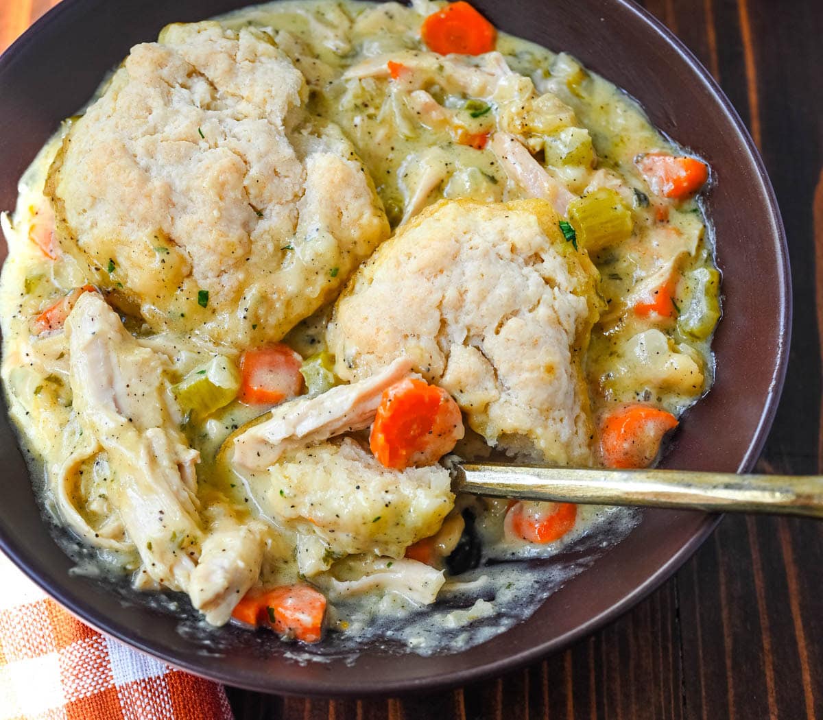 This homemade chicken cobbler is the from-scratch version of the viral casserole everyone has been making, with a rich, creamy chicken filling and buttery cheddar garlic drop biscuits baked right on top. No boxed biscuit mix. No canned cream of chicken soup. Just real ingredients and a one-pan dinner that tastes like you spent all afternoon on it.