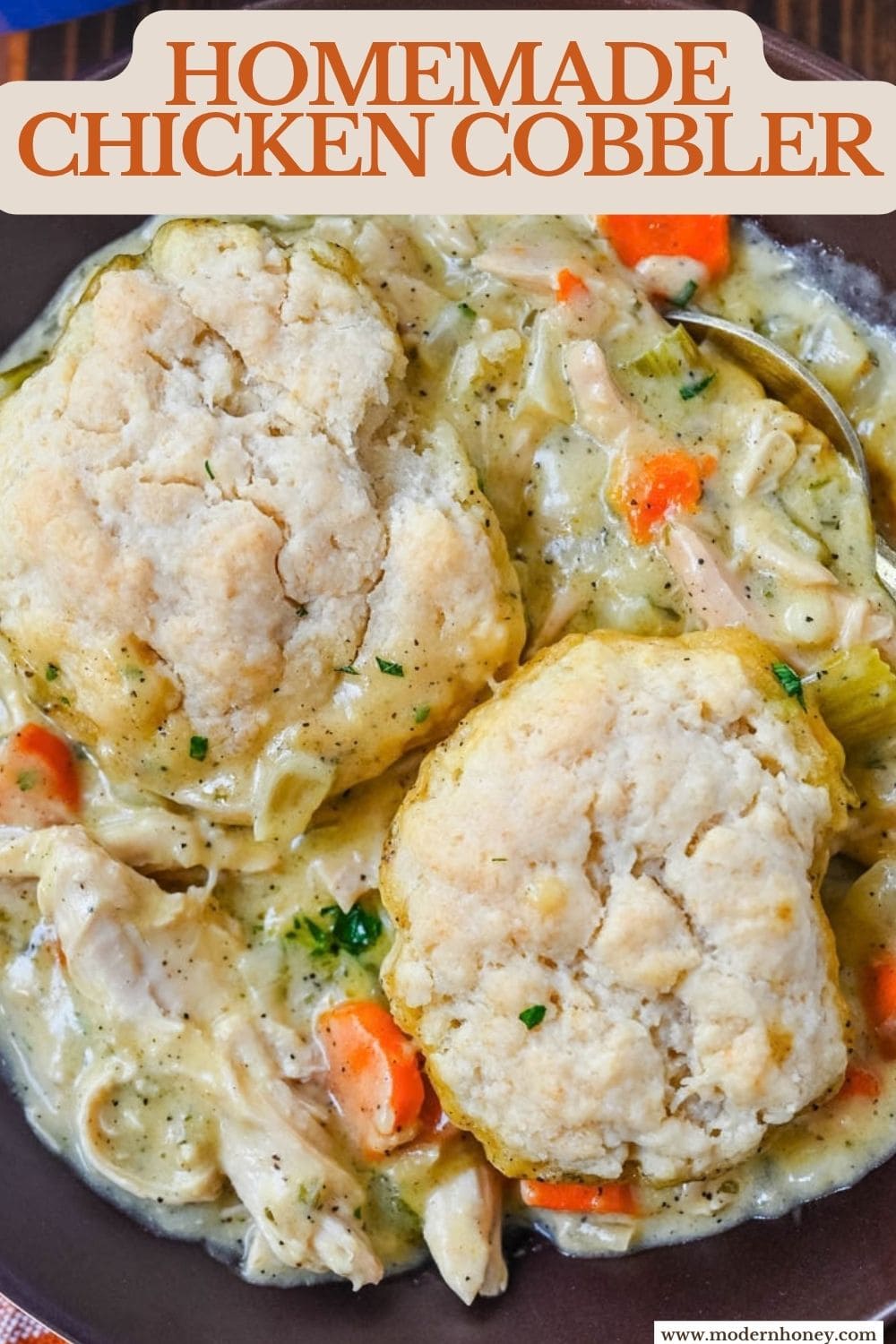This homemade chicken cobbler is the from-scratch version of the viral casserole everyone has been making, with a rich, creamy chicken filling and buttery cheddar garlic drop biscuits baked right on top. No boxed biscuit mix. No canned cream of chicken soup. Just real ingredients and a one-pan dinner that tastes like you spent all afternoon on it.