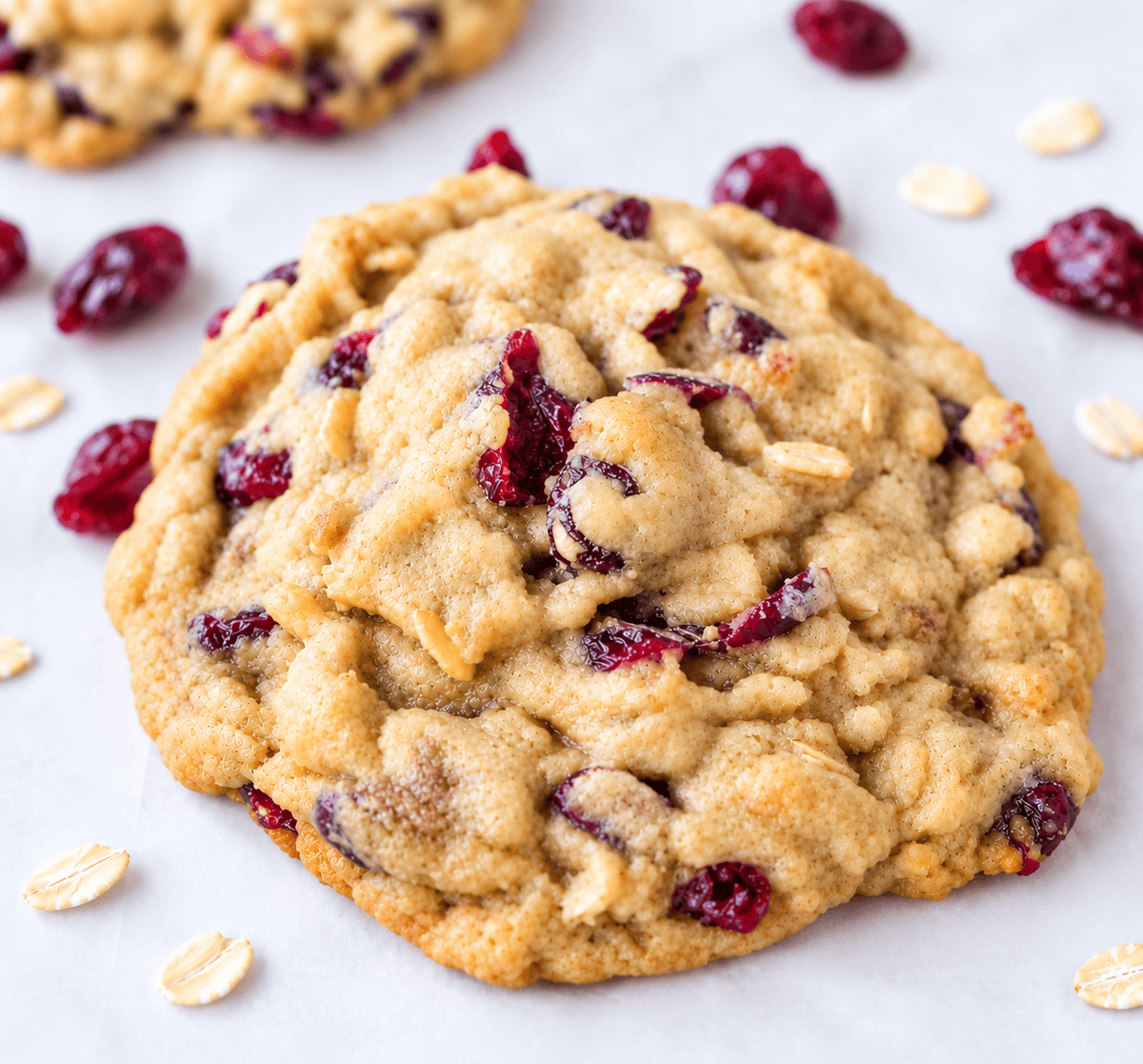 These soft and chewy cranberry oatmeal cookies are packed with sweetened dried cranberries and hearty oats, with a secret ingredient for the perfect texture. These are the best cranberry oatmeal cookies and always receive 5-star reviews.