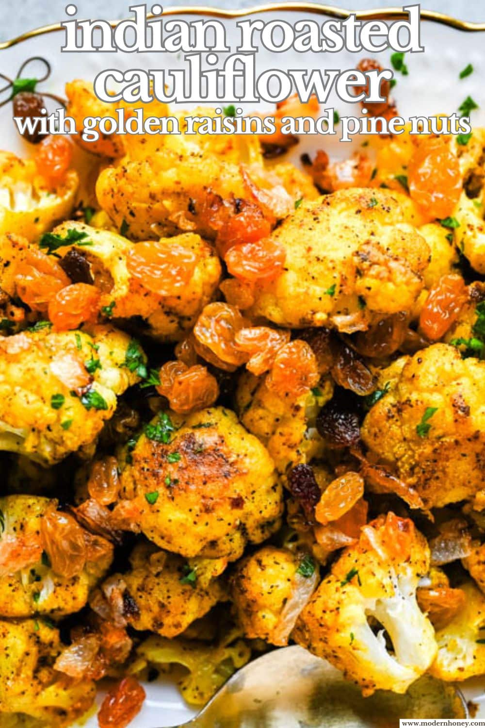 Indian Roasted Cauliflower with Golden Raisins and Pine Nuts. Golden, tender turmeric and curry roasted cauliflower tossed with sweet caramelized onion, golden raisins, and pine nuts. An easy vegan-friendly side.