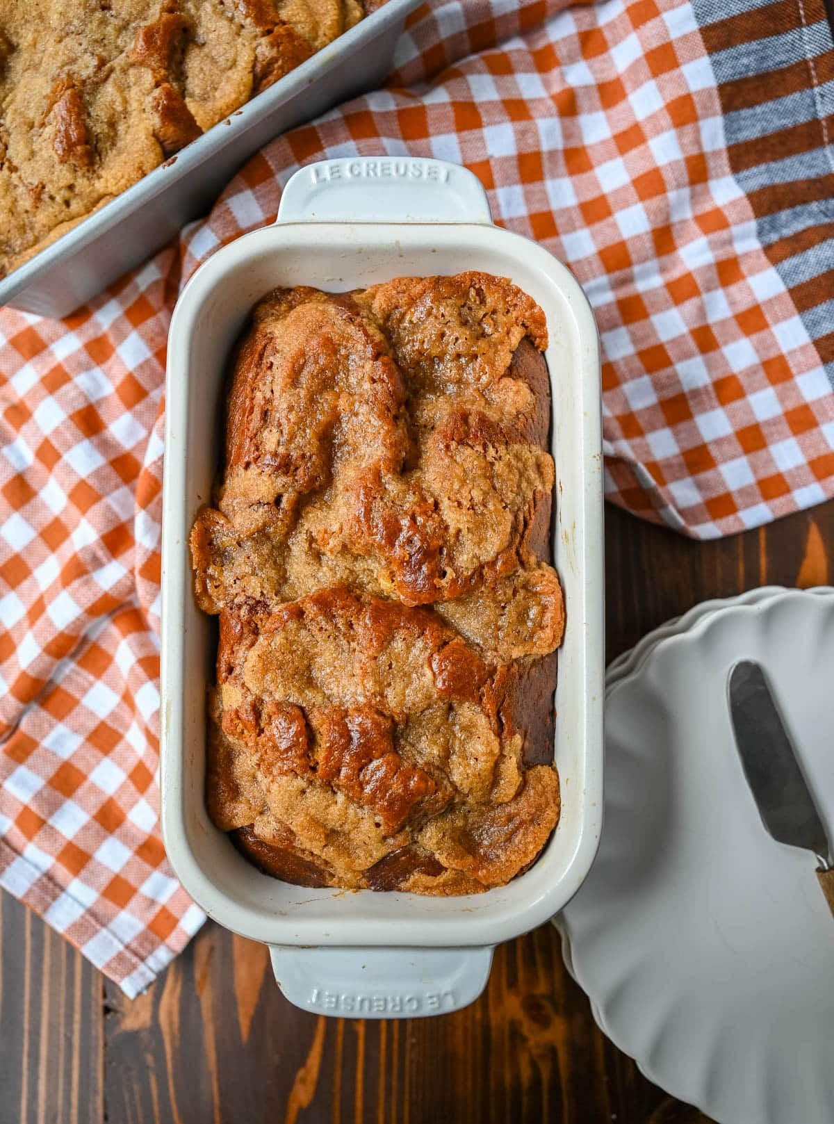 This pumpkin cream cheese bread has a thick ribbon of tangy cheesecake running through the middle, a buttery brown sugar streusel on top, and one simple trick that gives it the deepest, richest pumpkin flavor you've had in a loaf. This is the best pumpkin cream cheese bread recipe and it makes two loaves.