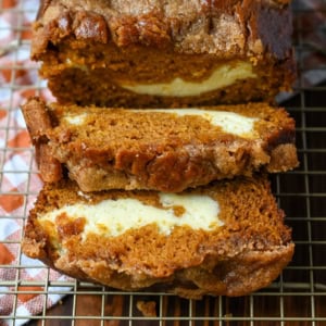 Best Pumpkin Cream Cheese Bread Recipe. This pumpkin cream cheese bread has a thick ribbon of tangy cheesecake running through the middle, a buttery brown sugar streusel on top, and one simple trick that gives it the deepest, richest pumpkin flavor you've had in a loaf. It makes two loaves, so you can keep one and give one away.