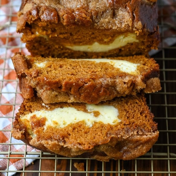 Best Pumpkin Cream Cheese Bread Recipe. This pumpkin cream cheese bread has a thick ribbon of tangy cheesecake running through the middle, a buttery brown sugar streusel on top, and one simple trick that gives it the deepest, richest pumpkin flavor you've had in a loaf. It makes two loaves, so you can keep one and give one away.