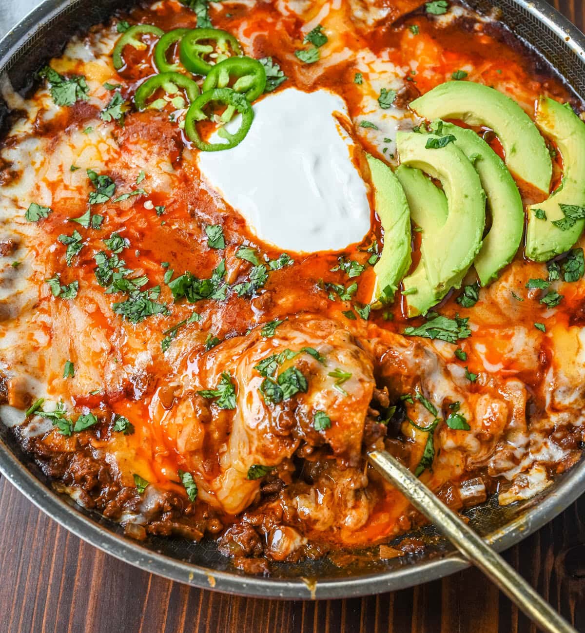 This easy Beef Enchilada Skillet recipe turns classic beef enchiladas into a quick, one-pan dinner. Ground beef, tortilla pieces, and a rich red enchilada sauce simmer together until thick and saucy, then get topped with plenty of melted cheese. Ready in about 20 minutes, making it a go-to weeknight dinner for busy nights.