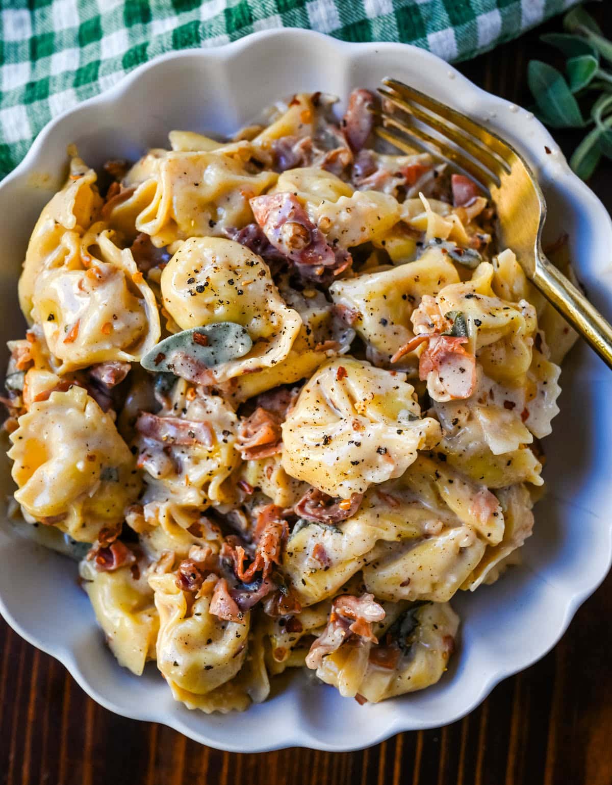 Cheese Tortellini with a brown butter parmesan cheese sauce, crispy prosciutto, and fresh sage. This easy pasta dinner!