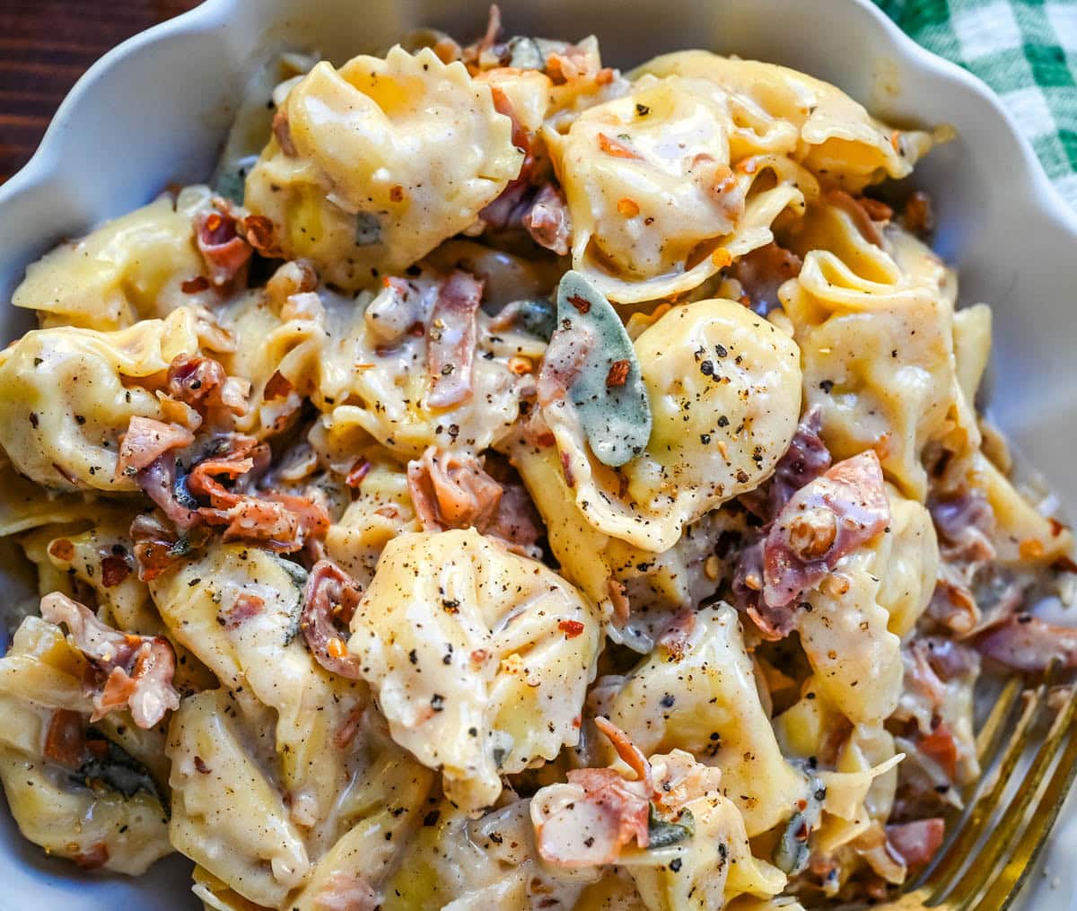 Brown Butter Cheese Tortellini in a creamy parmesan cheese sauce with prosciutto and sage.