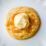 Turn your favorite cornbread into a cookie! These soft cornbread cookies have crisp golden edges, a tender cornmeal crumb, and whipped honey butter on top. Better than Crumbl!