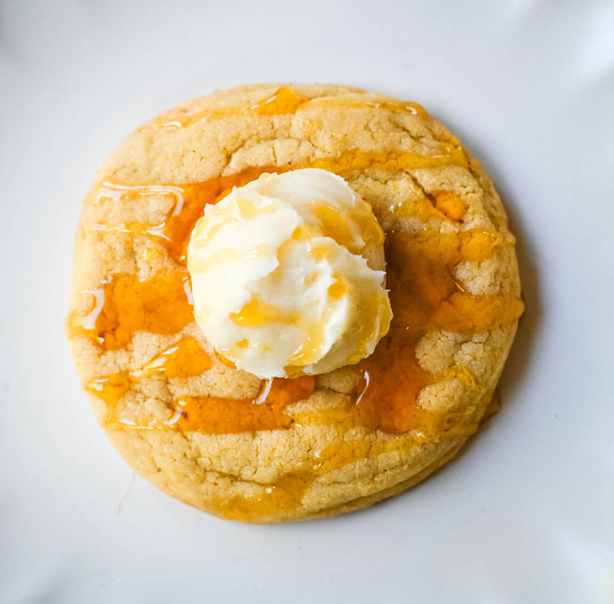 Turn your favorite cornbread into a cookie! These soft cornbread cookies have crisp golden edges, a tender cornmeal crumb, and whipped honey butter on top. Better than Crumbl!
