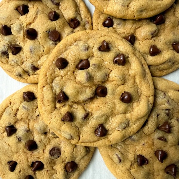 These Mrs. Fields Chocolate Chip Cookies taste just like the famous mall cookies! This easy copycat recipe makes soft, chewy chocolate chip cookies with buttery, golden edges and loads of melty chocolate chips. This is the authentic recipe found in Mrs. Field's cookbook.